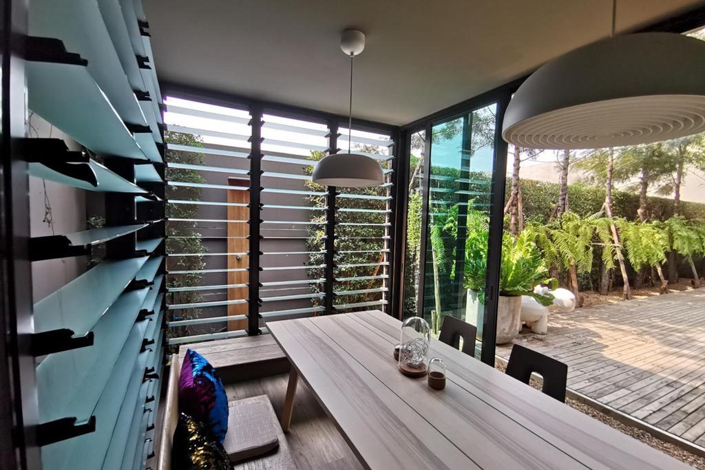 Breezway Louvres wide open allow fresh air to ventilate protected sitting area