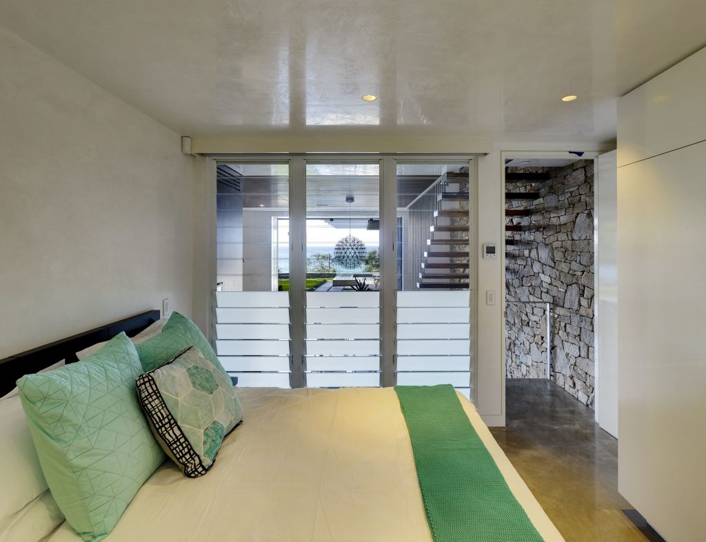 Breezway louvres with mixed glass blades in the bedroom for light and privacy 